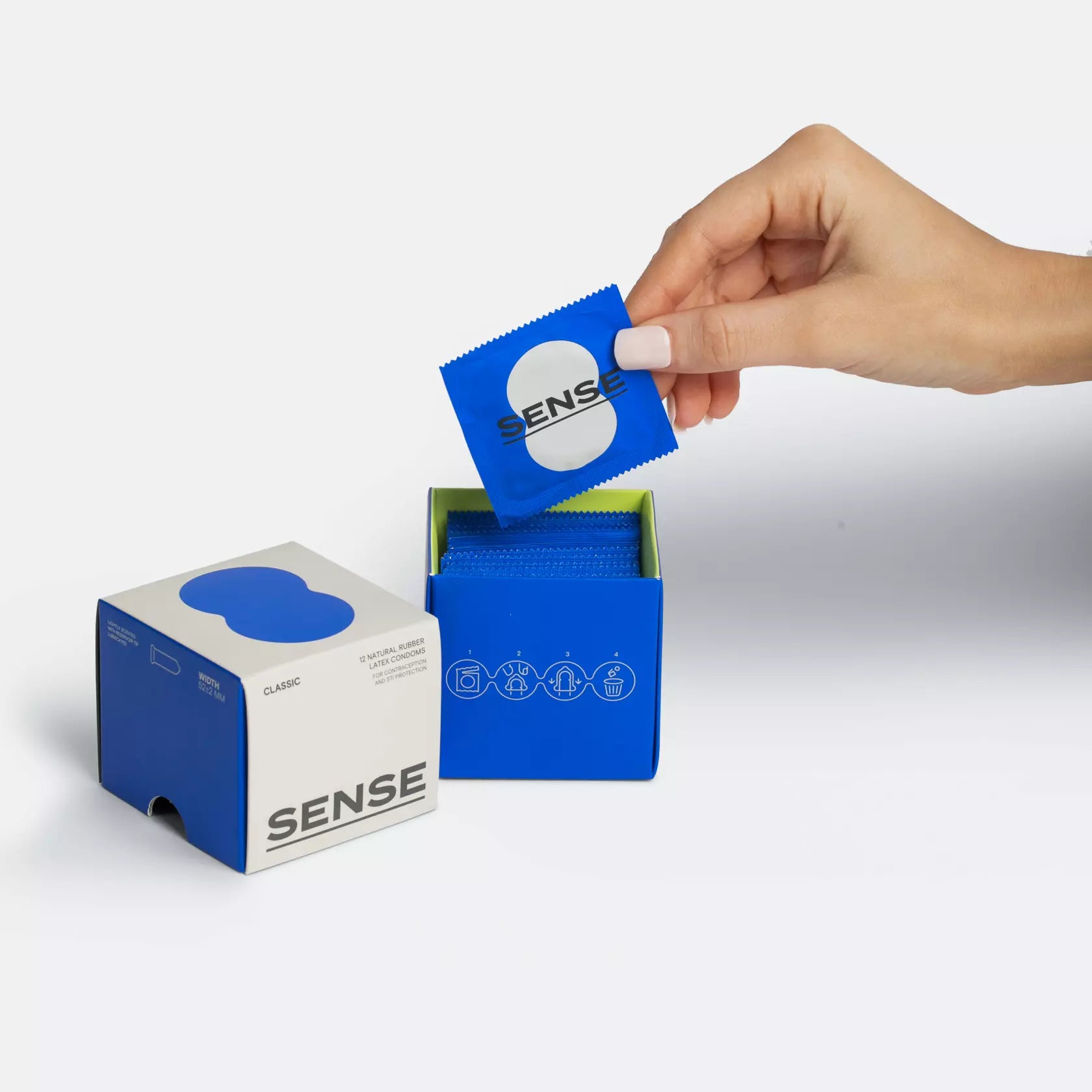 Woman hands opening a 12 pack of Sense premium natural rubber latex condoms