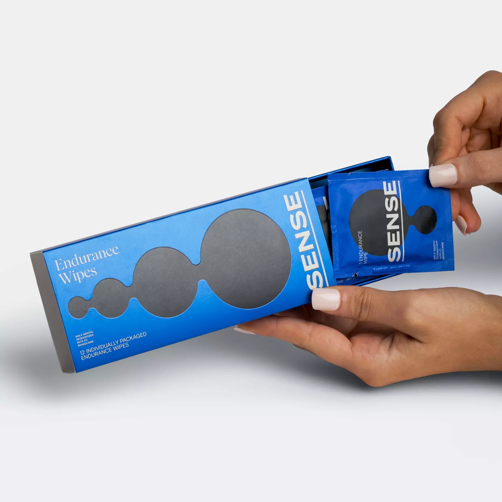 Woman grabbing a wipe from sense endurance wipes 12 pack