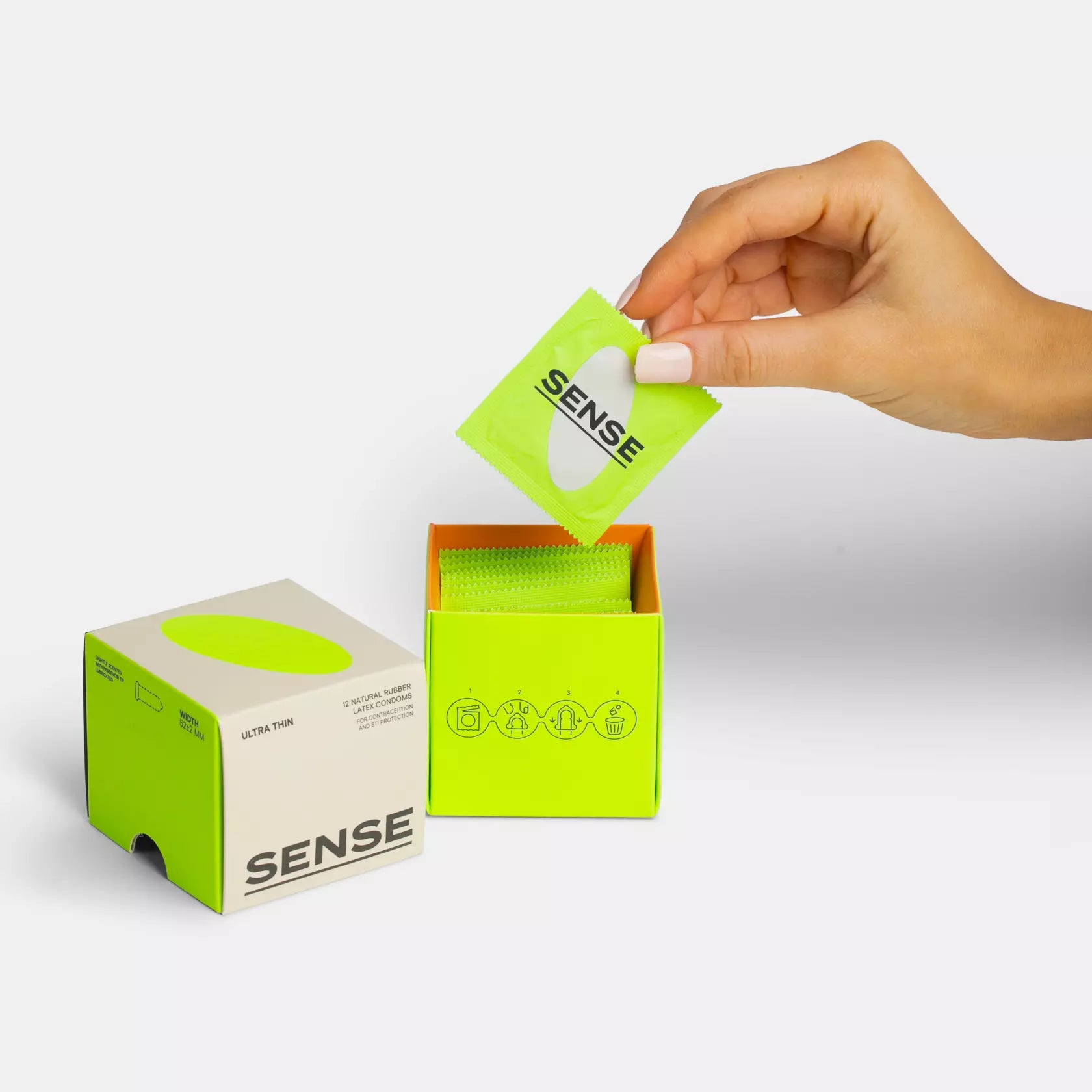 Woman grabbing a condom from sense ultra thin natural rubber latex condoms 12 pack